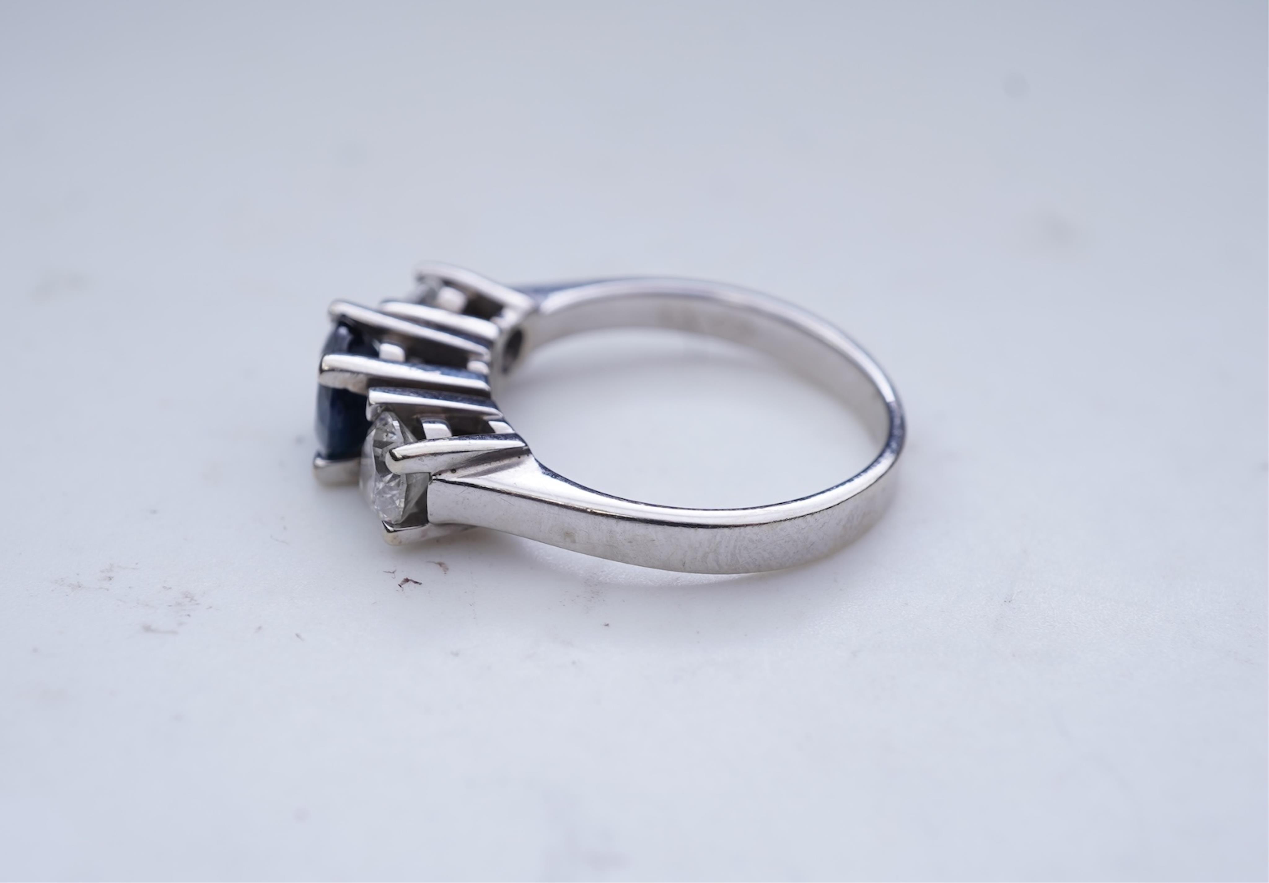 A sapphire and diamond three-stone ring